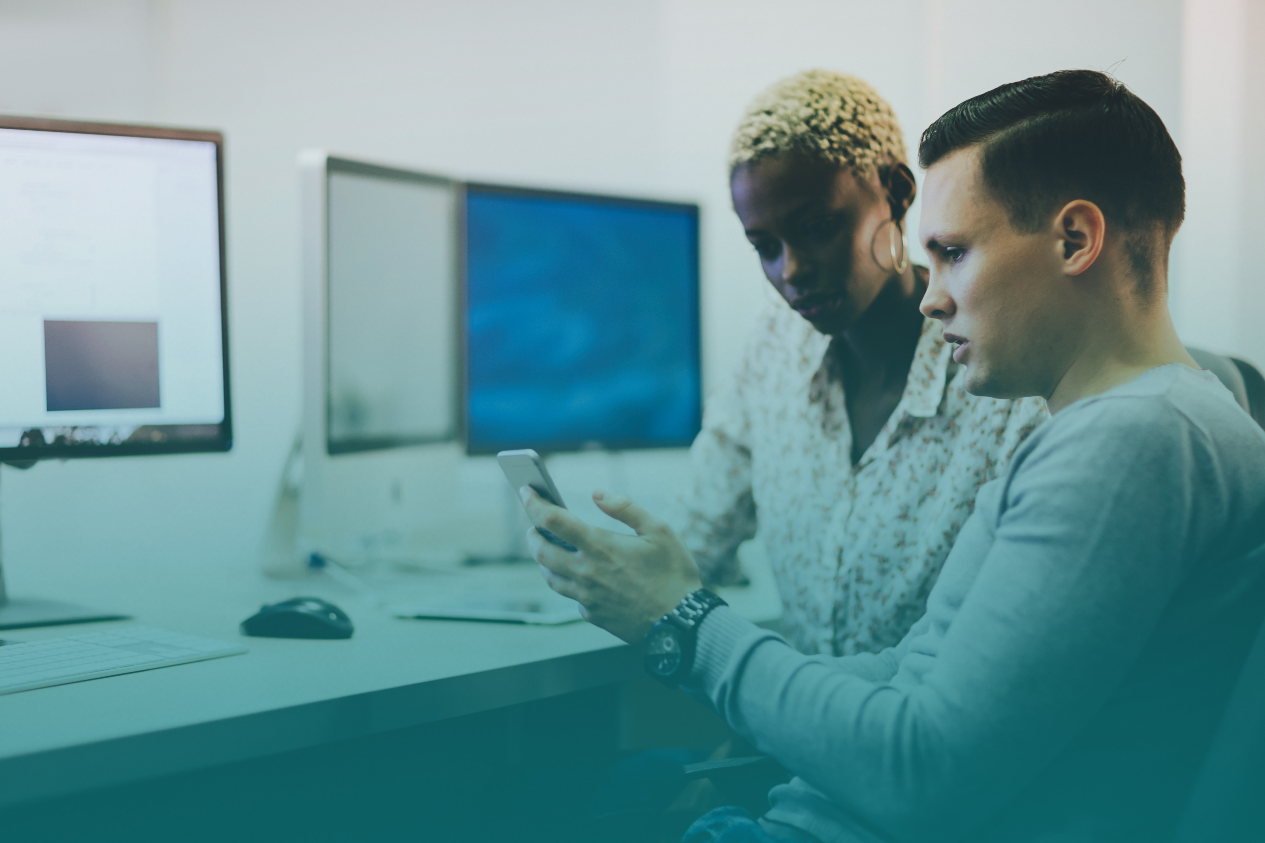 Programmers cooperating at information technology company